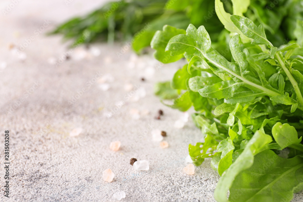 Fresh arugula on light table, closeup