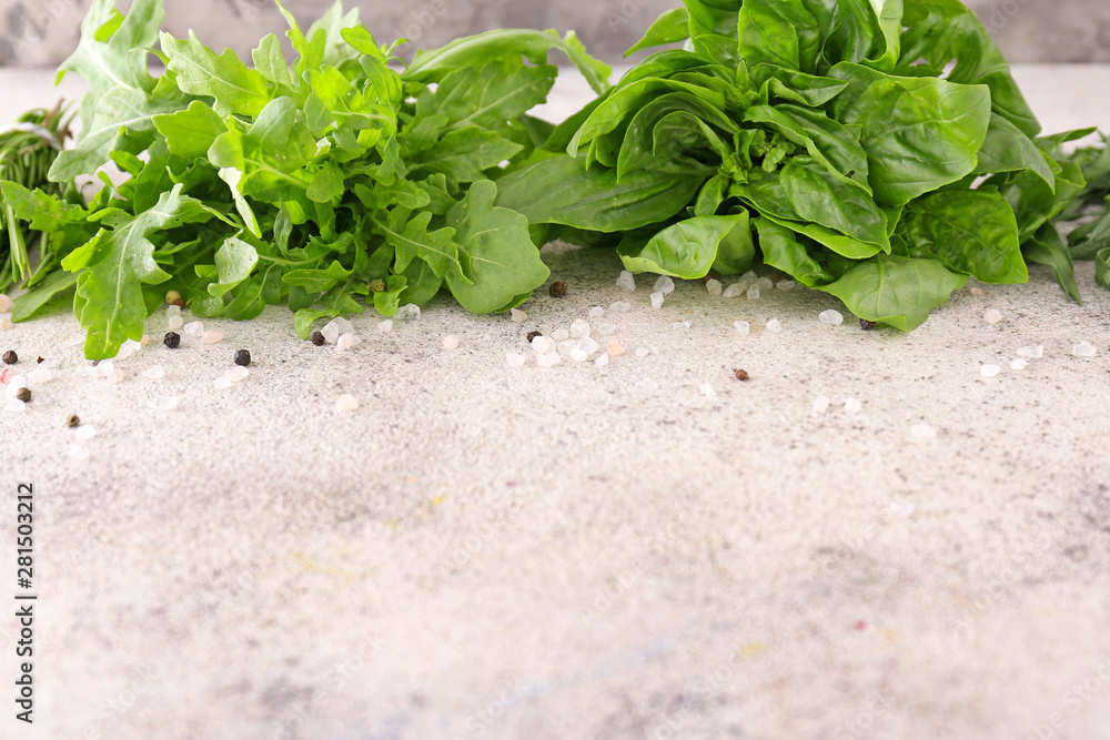 Different fresh herbs with spices on light table