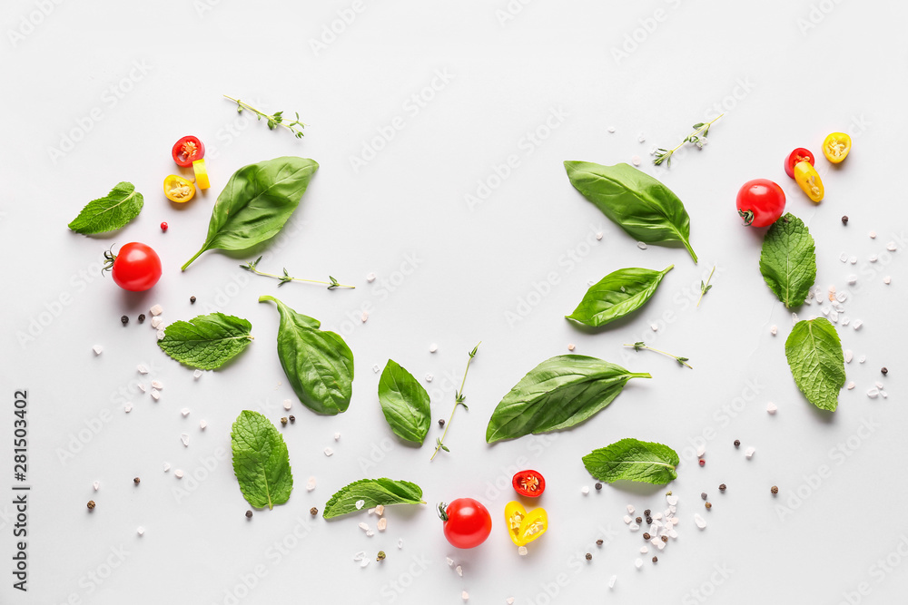 Fresh herbs with vegetables and spices on white background