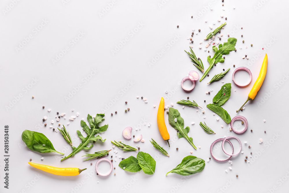 Fresh herbs with vegetables and spices on white background