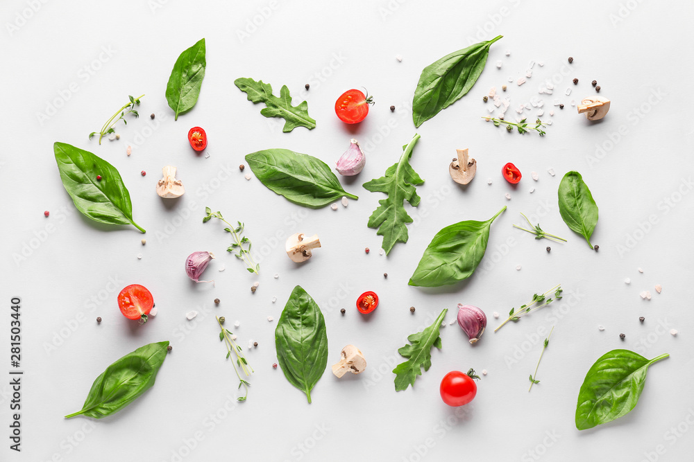 Fresh herbs with vegetables, mushrooms and spices on white background