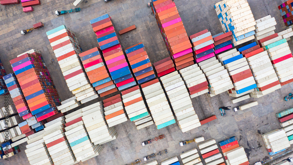 Aerial view reach stackers move containers at a freight terminal, Industrial container terminal and 