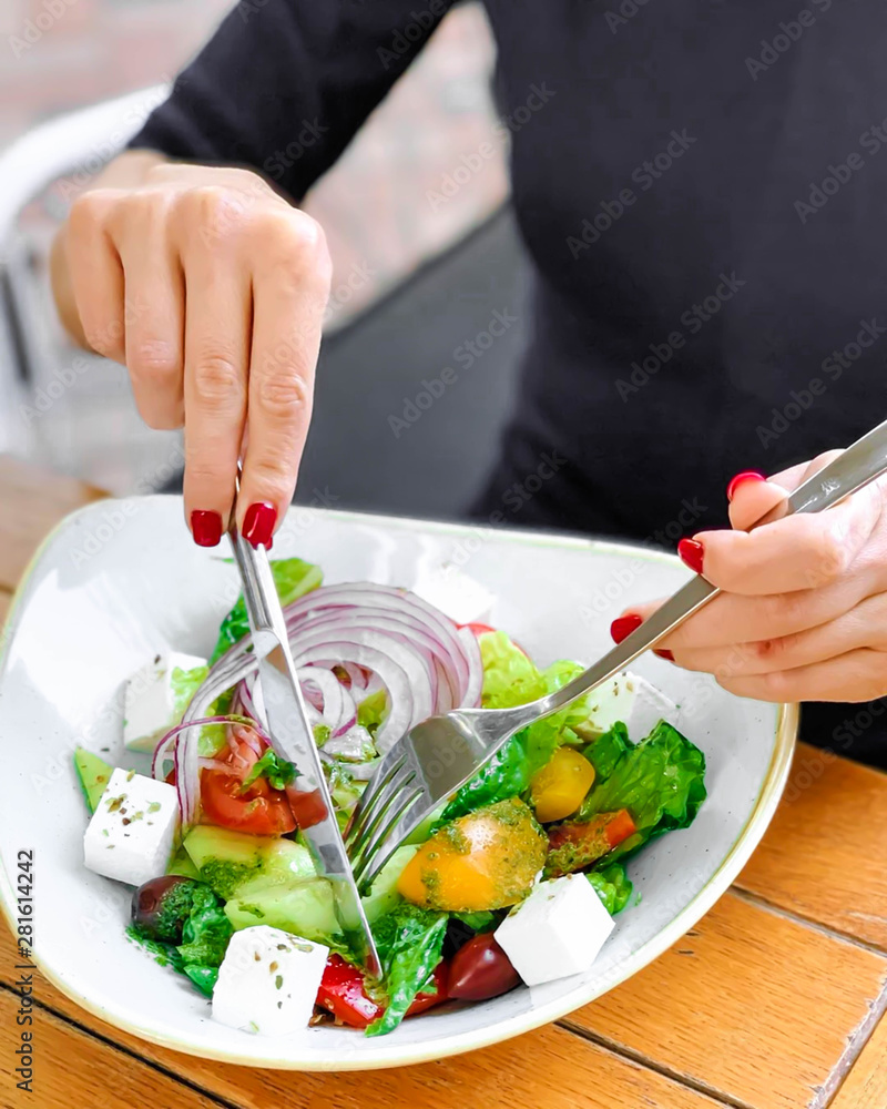 Greek salad with fresh vegetables, feta cheese and black olives