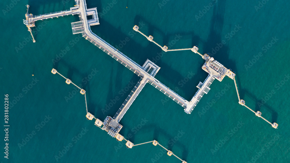 Aerial view crude oil and gas terminal, Loading arm oil and gas refinery at commercial port.