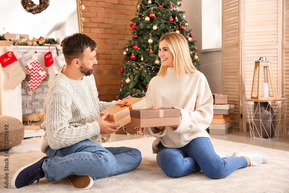 Happy couple greeting each other on Christmas eve