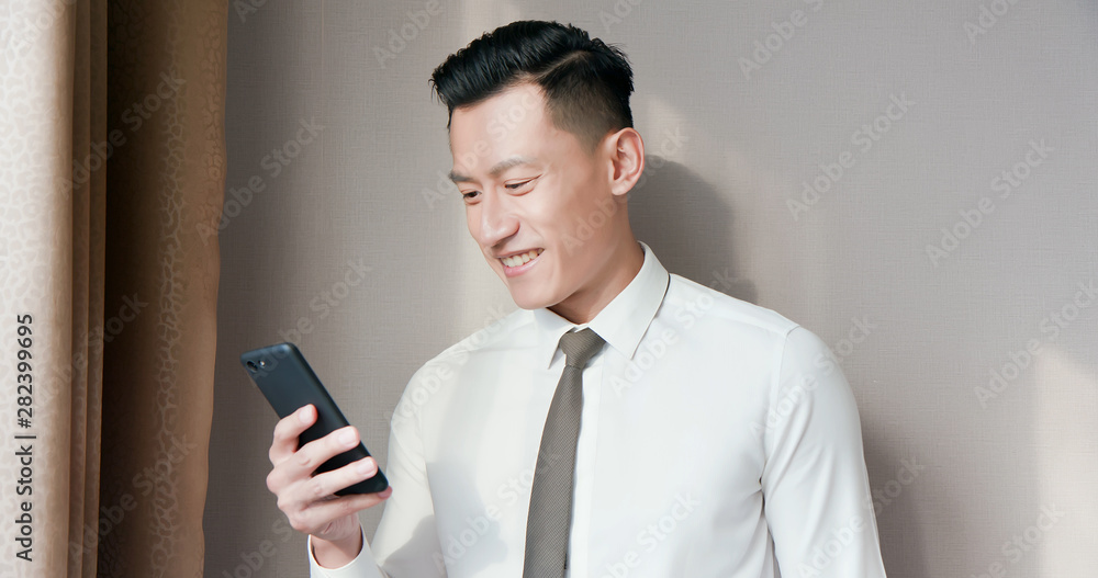 Asian businessman use cellphone