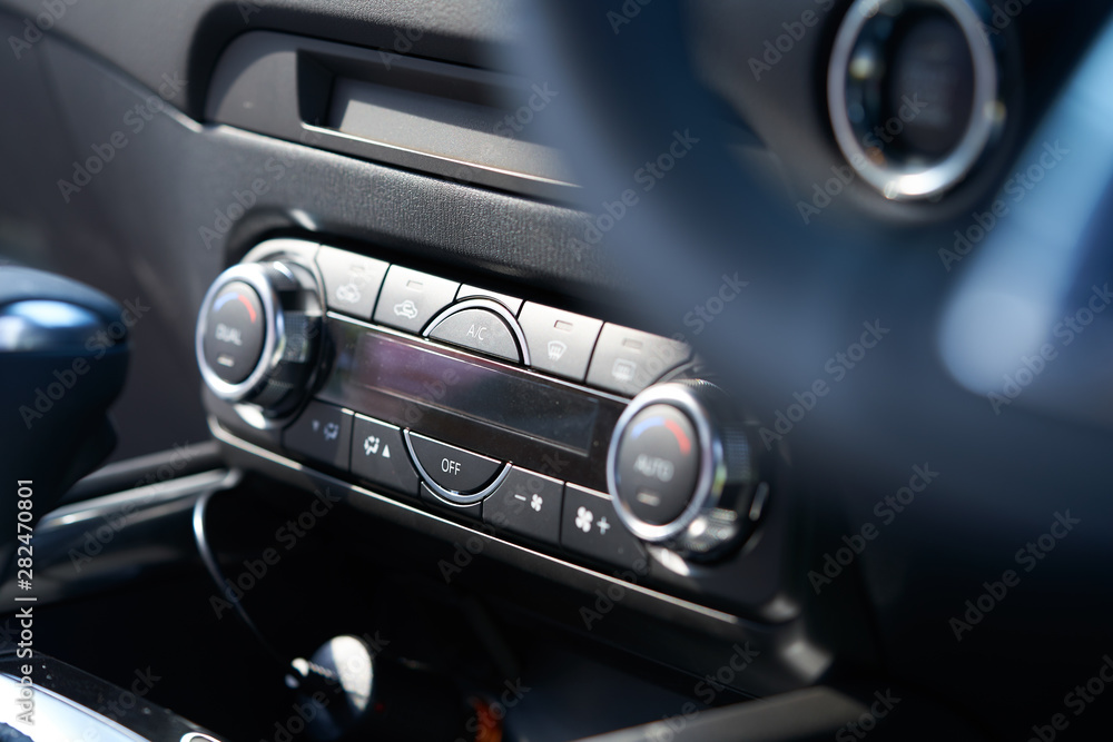 Vehicle interior of a modern car with air conditioner controller