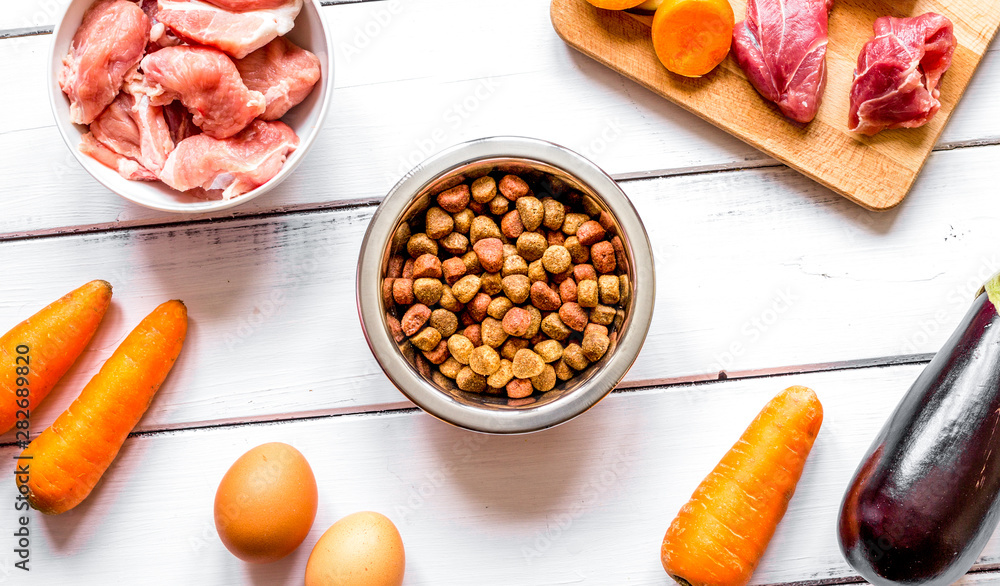 ingredients for pet food holistic top view on wooden background