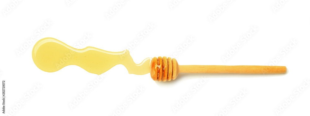 Wooden honey dipper on white background