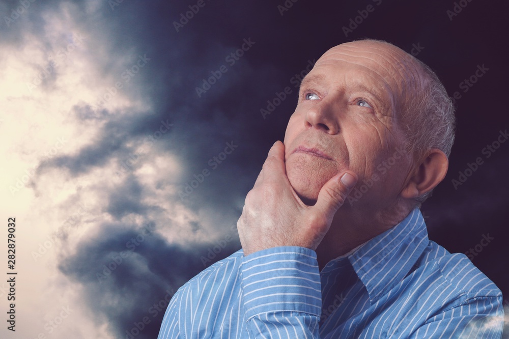 Thoughtful senior man at home