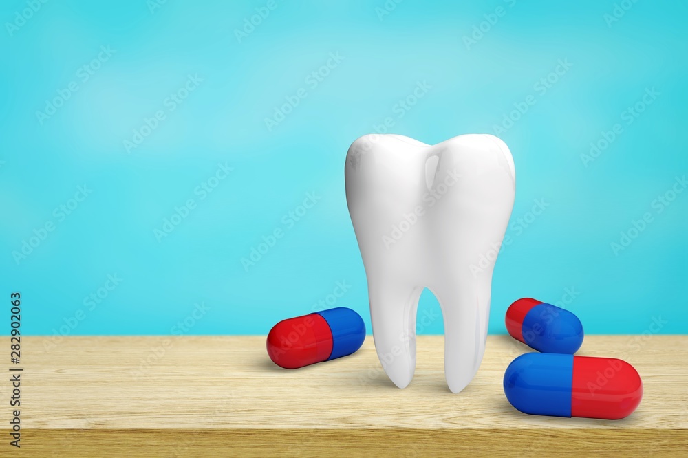 Big tooth model and toothbrush on light background