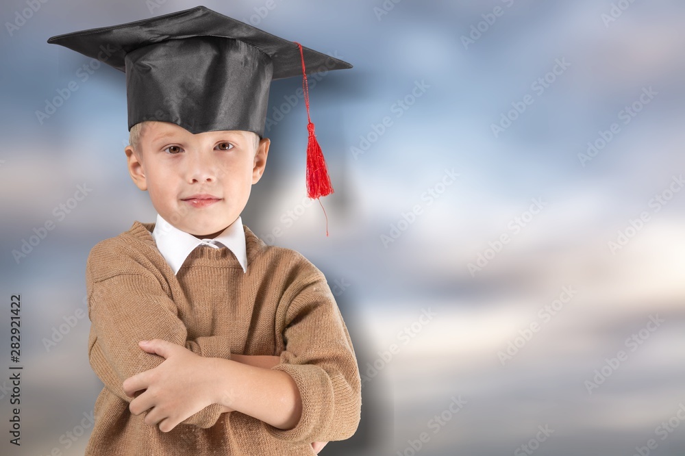 Cute little girl with  books on  background