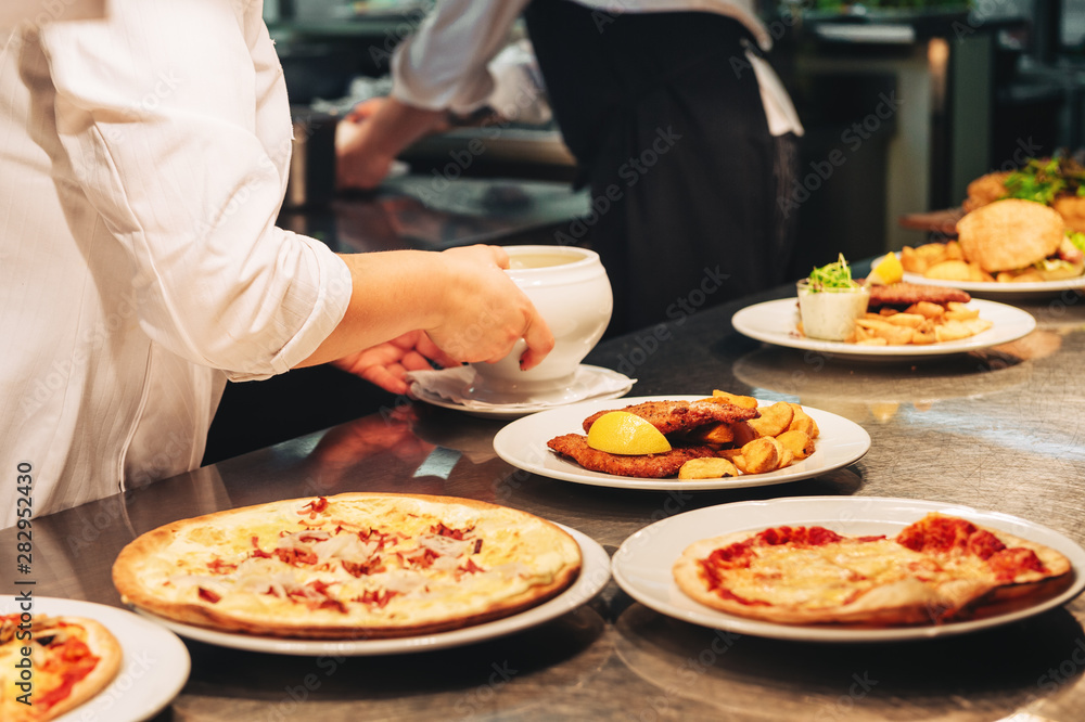 Food orders on the kitchen table in the restaurant