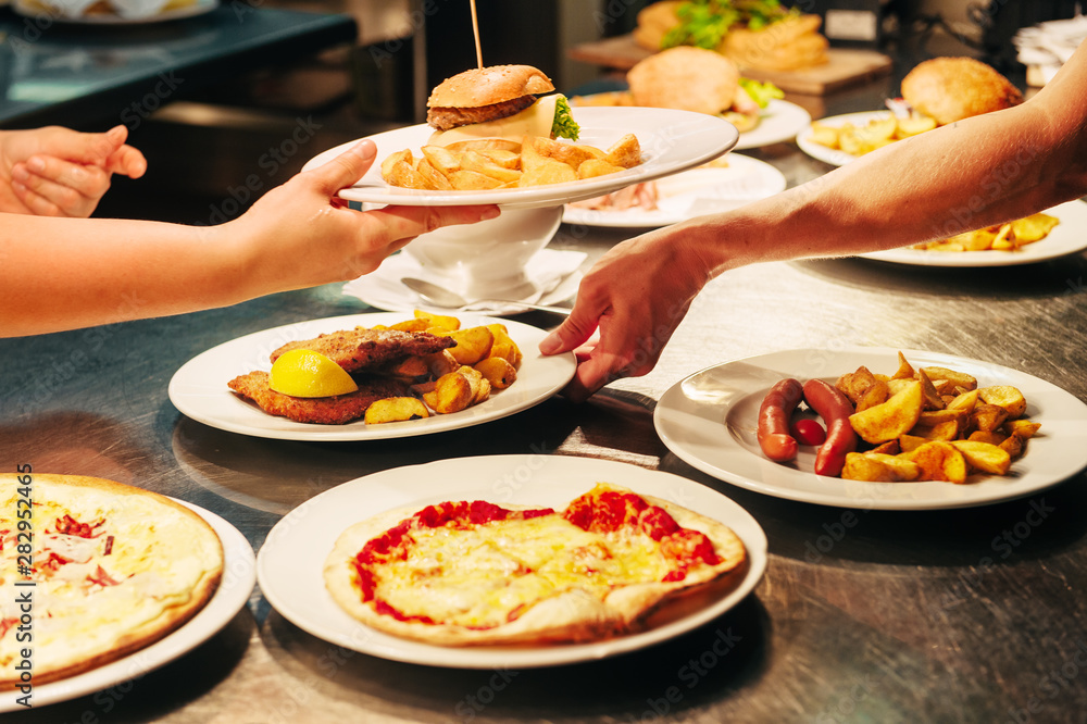 Food orders on the kitchen table in the restaurant