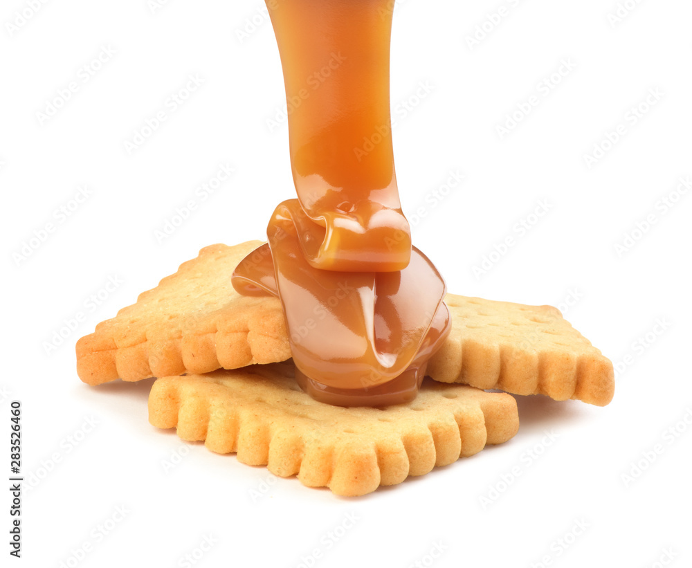 Cookies poured with sweet caramel on a white background