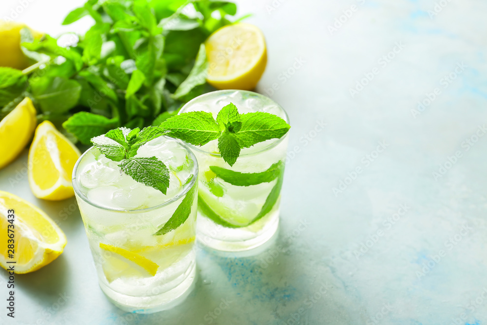 Glasses of fresh mojito on table