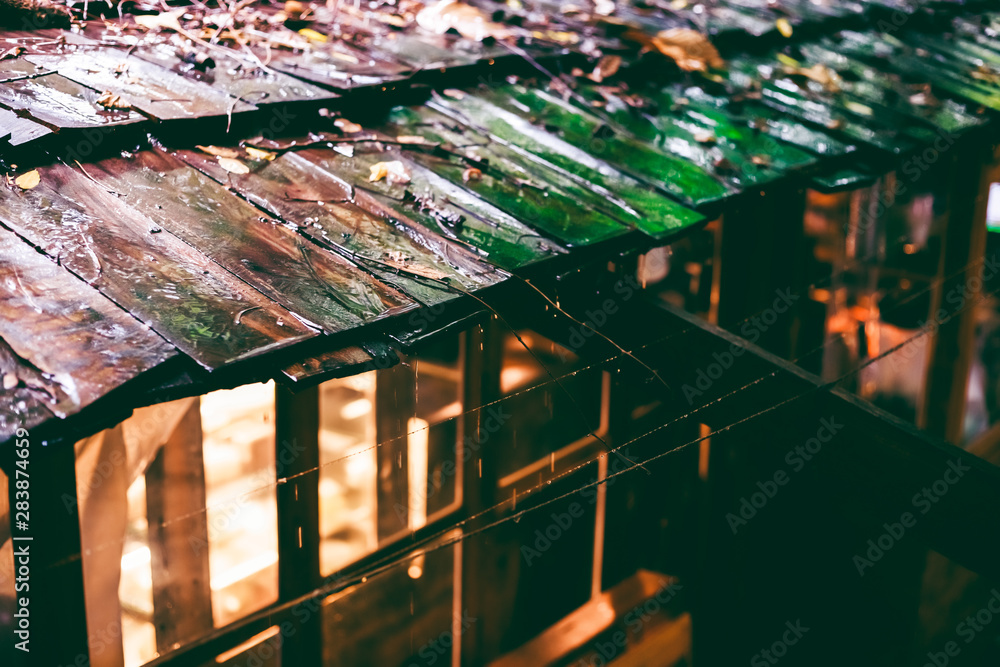 Old wooden roofs that are wet with rain, rain with wooden roofs, traditional house details