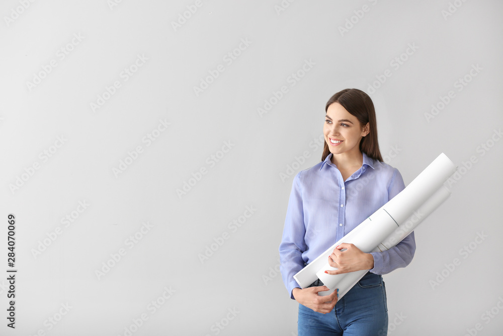 Beautiful female architect on white background