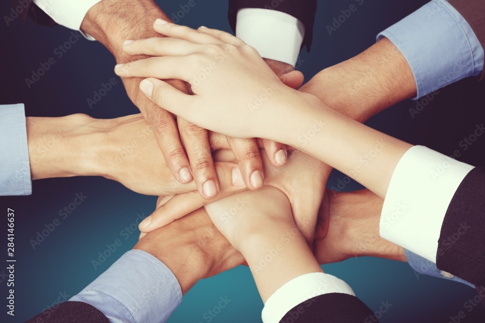 Top View of People in Circle with Their Hands Together