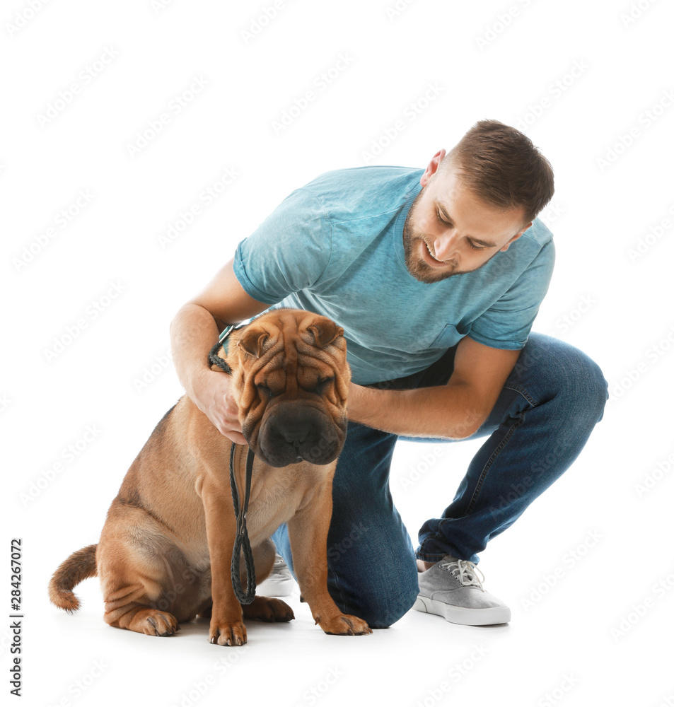 Happy man with cute dog on white background