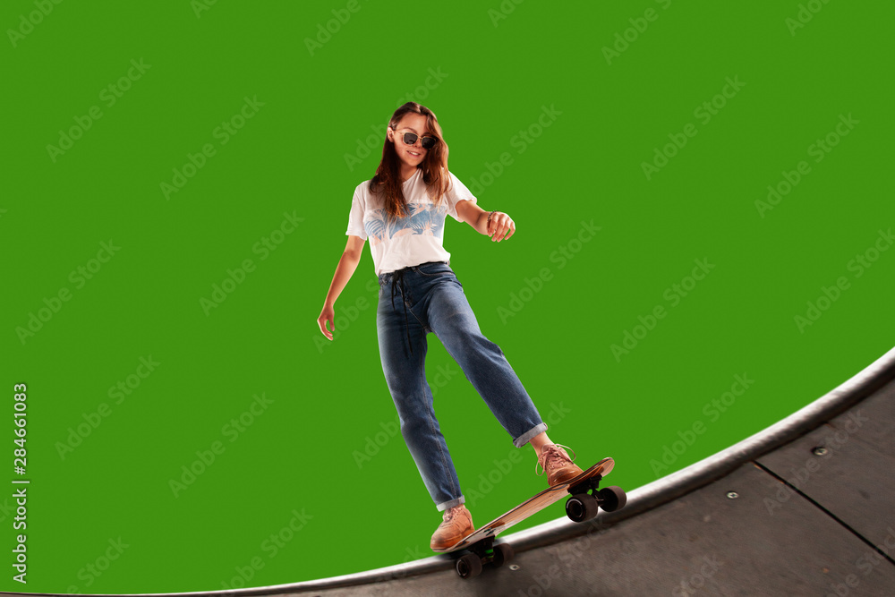 Skateboarder on green screen background.