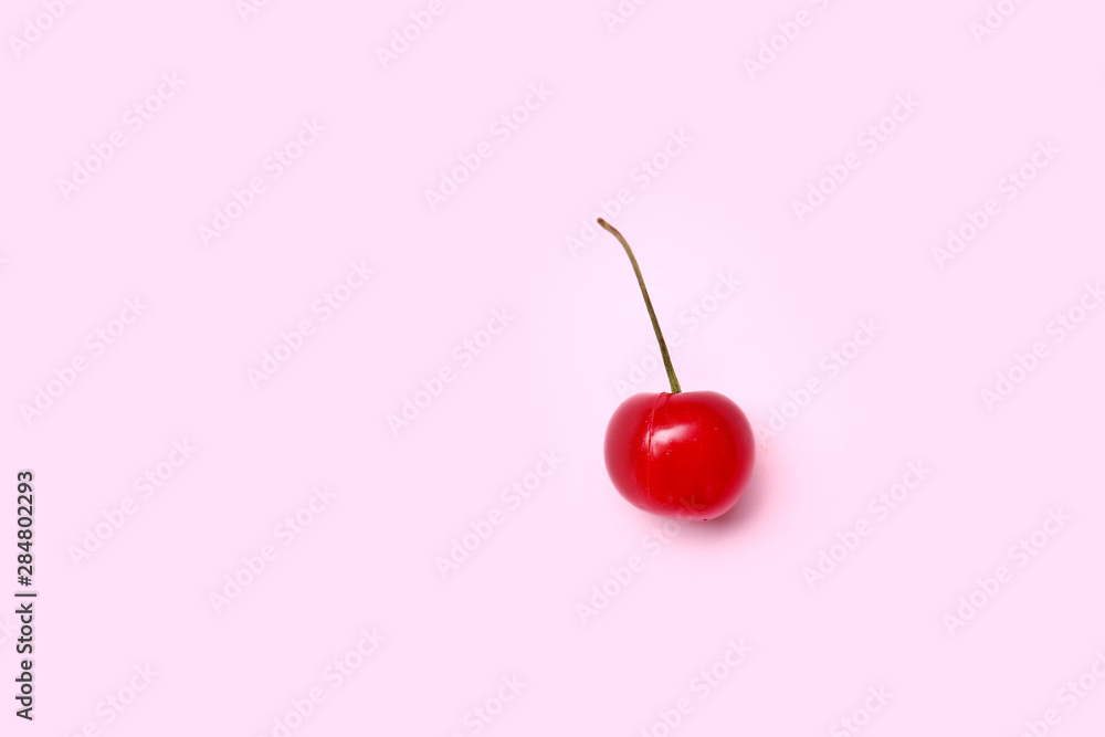 Ripe sweet cherry on color background