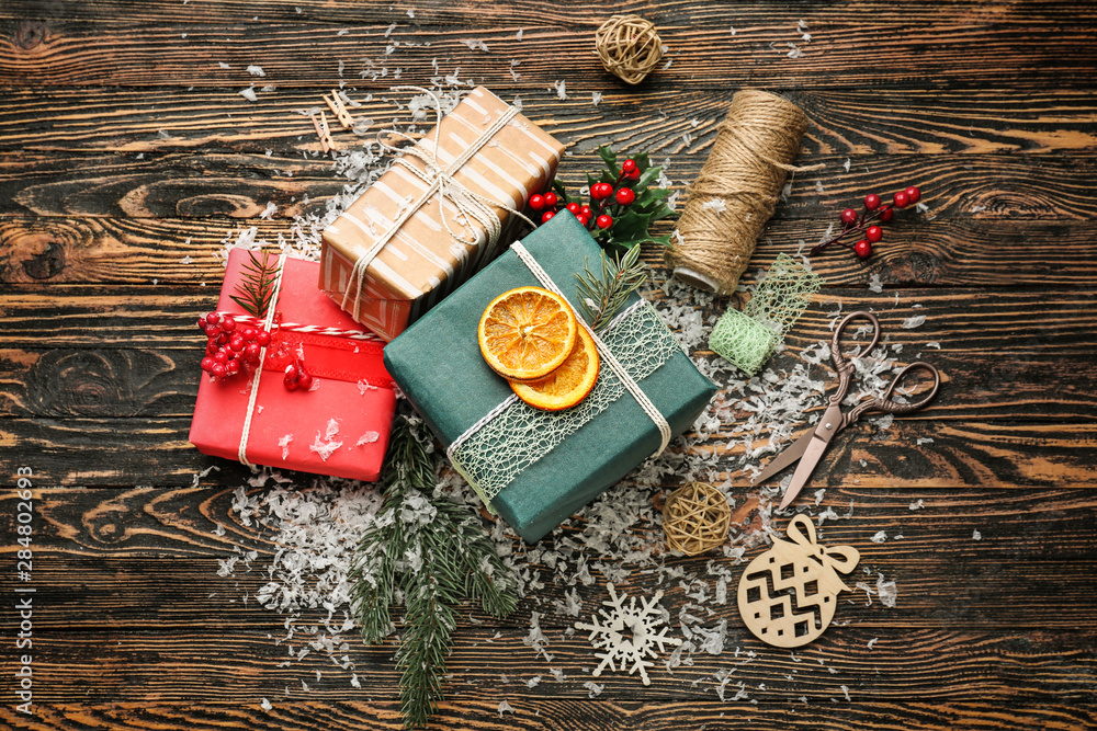 Beautiful Christmas gift boxes on wooden table