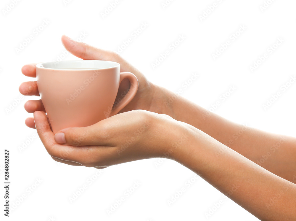 Female hands with cup of tea on white background