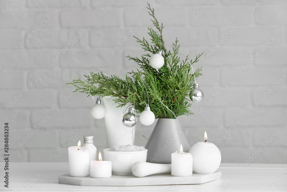 Christmas decor and products for spa treatment on table