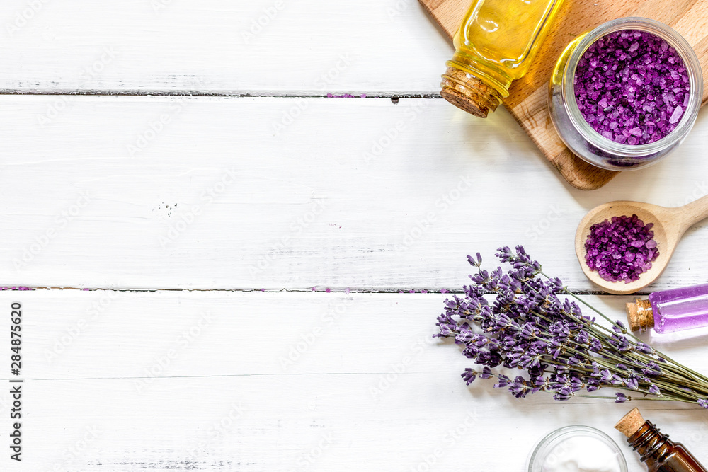 natural creams with lavender flowers on wooden table