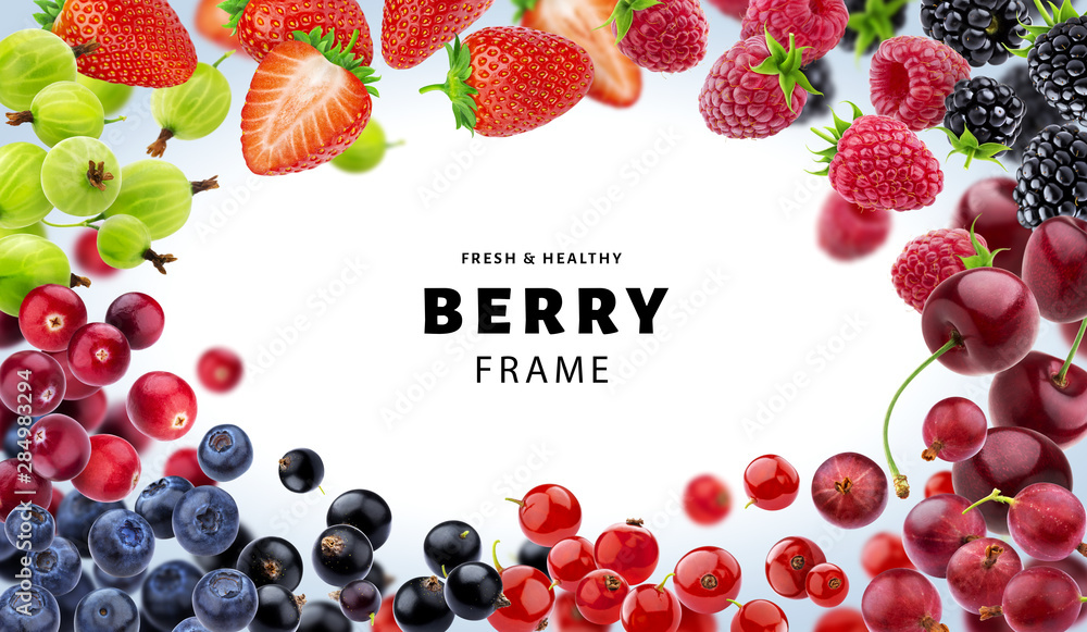 Frame made of different berries isolated on white background