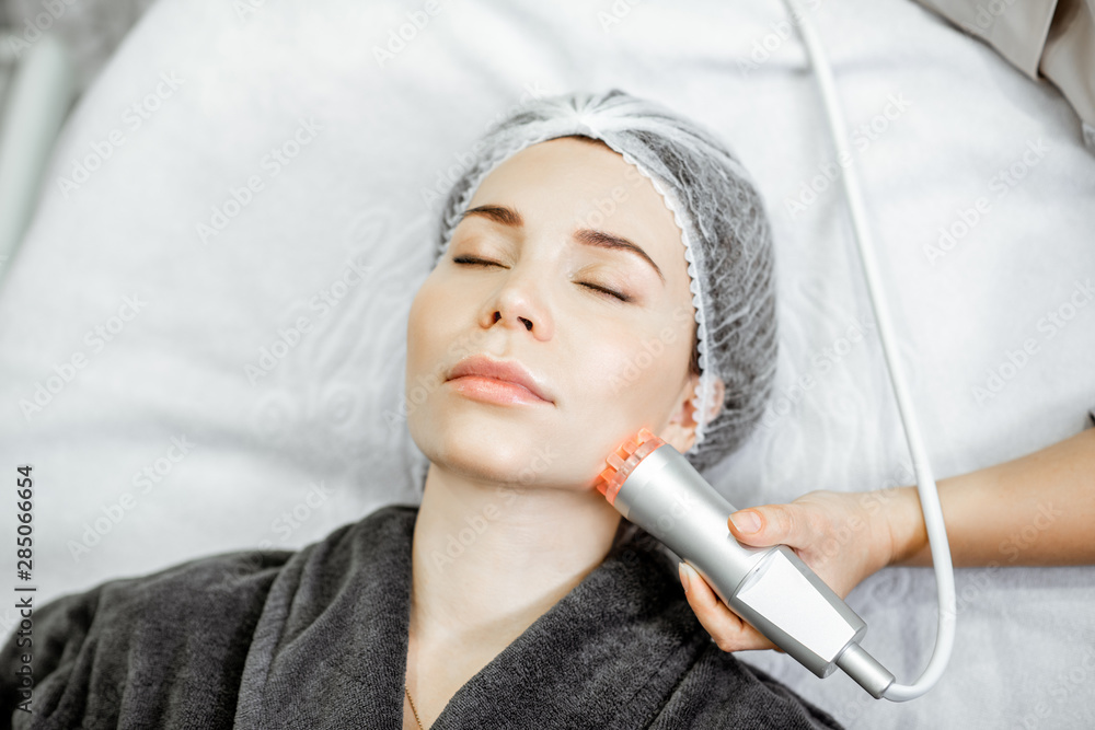 Woman during the oxygen mesotherapy procedure at the beauty salon, close-up view. Concept of a profe