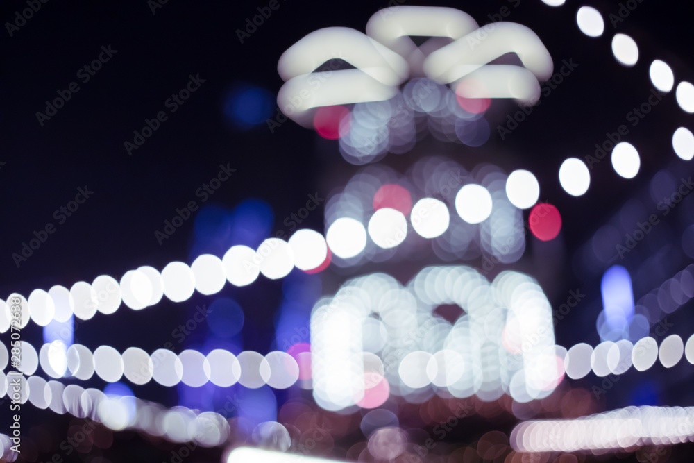 Christmas illumination on city streets bokeh background