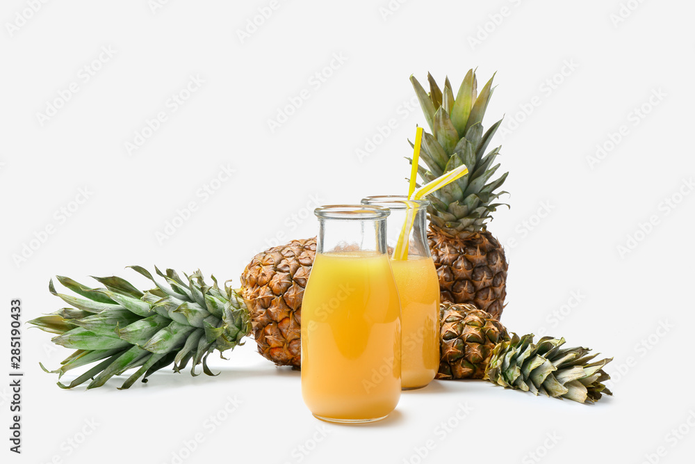 Composition with fresh pineapple juice on white background