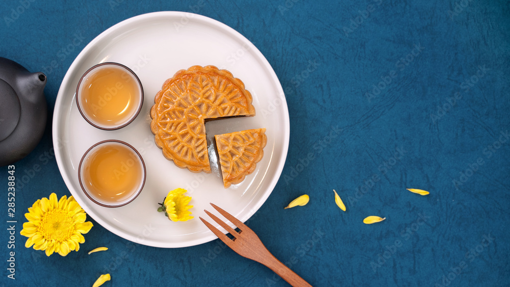 Minimal simplicity layout moon cakes on blue background for Mid-Autumn Festival, creative food desig