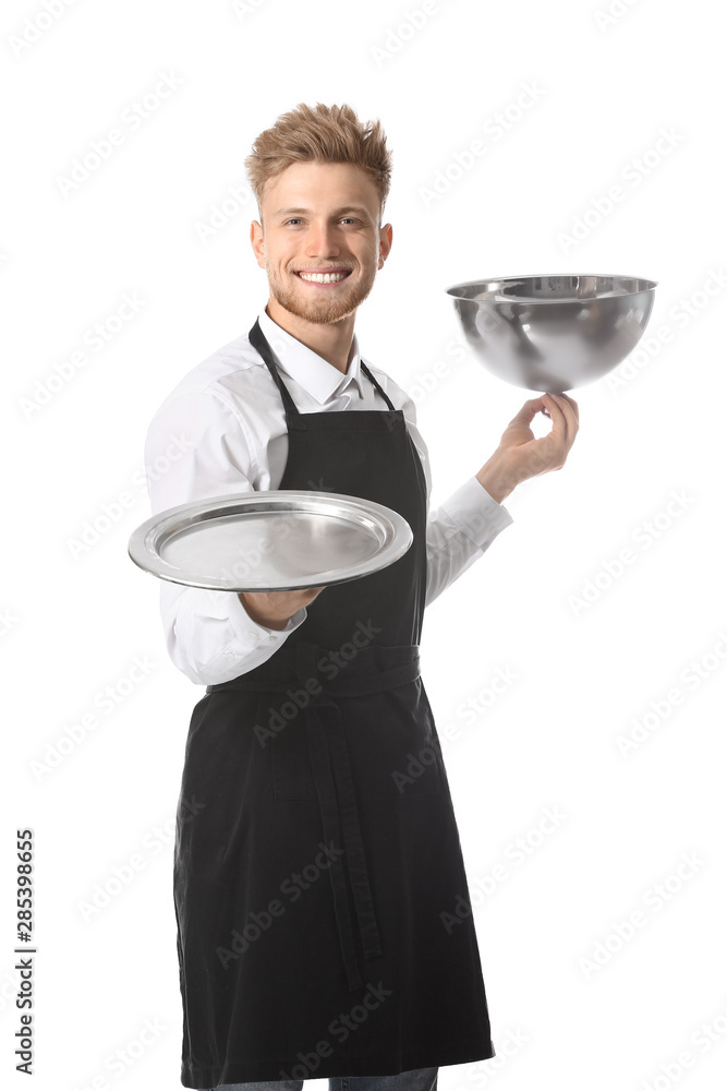 Handsome male chef with tray and cloche on white background