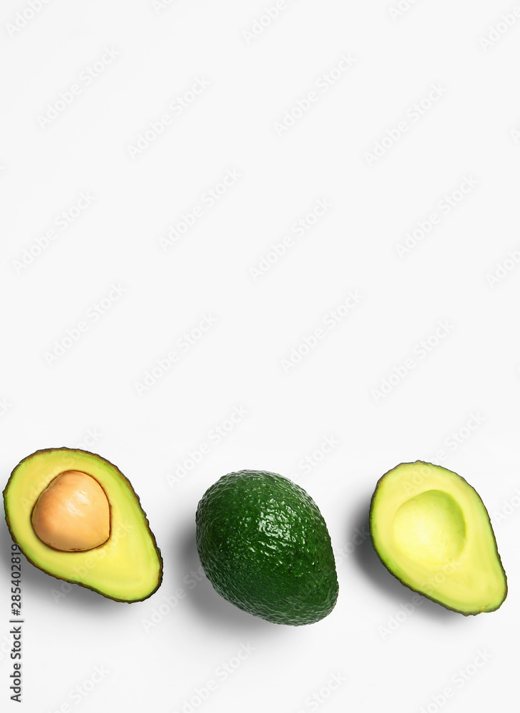 Ripe avocados on white background