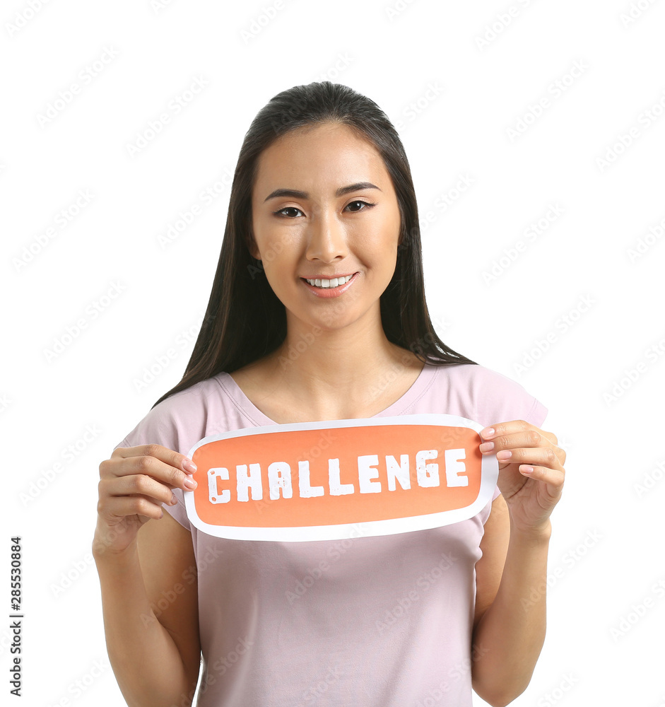 Female Asian blogger holding paper with text CHALLENGE on white background