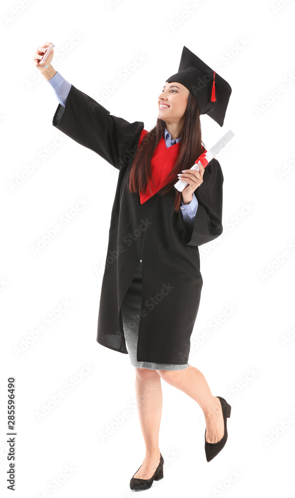 Female graduate taking selfie with diploma on white background