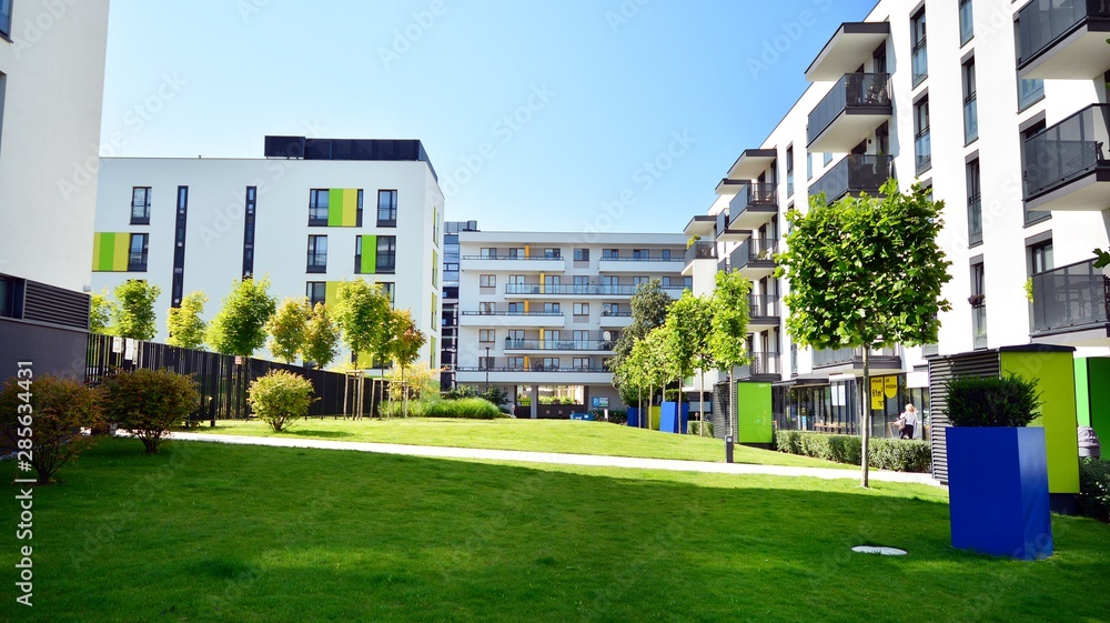 Contemporary residential building exterior in the daylight. Modern apartment buildings on a sunny da