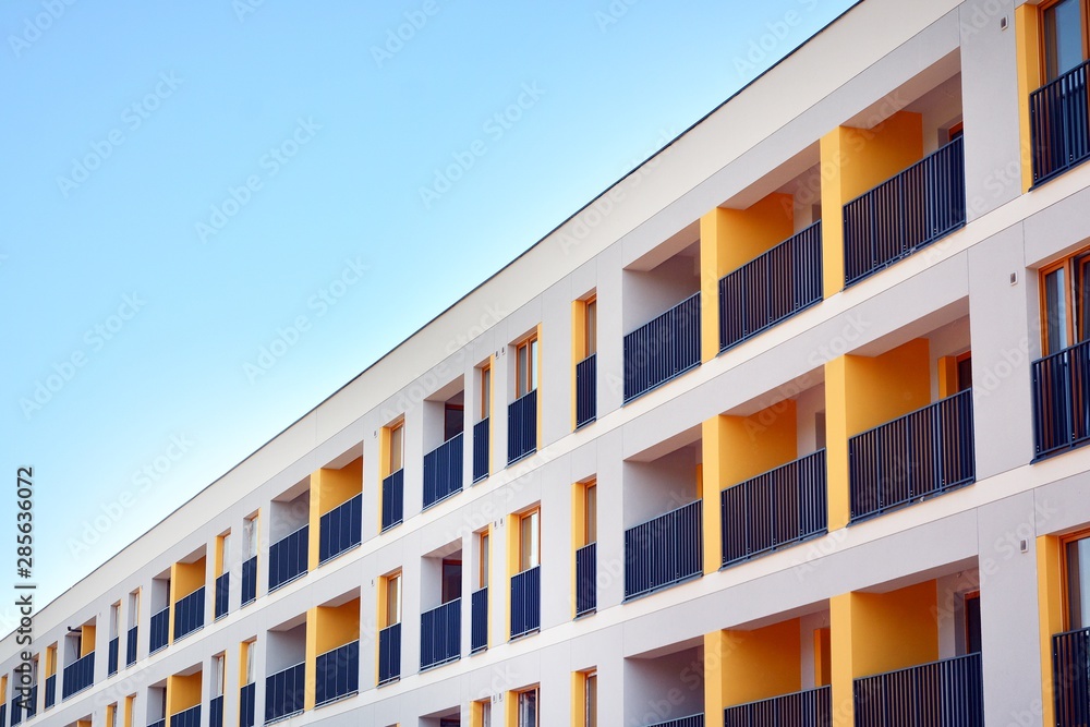 Contemporary residential building exterior in the daylight. Modern apartment buildings on a sunny da