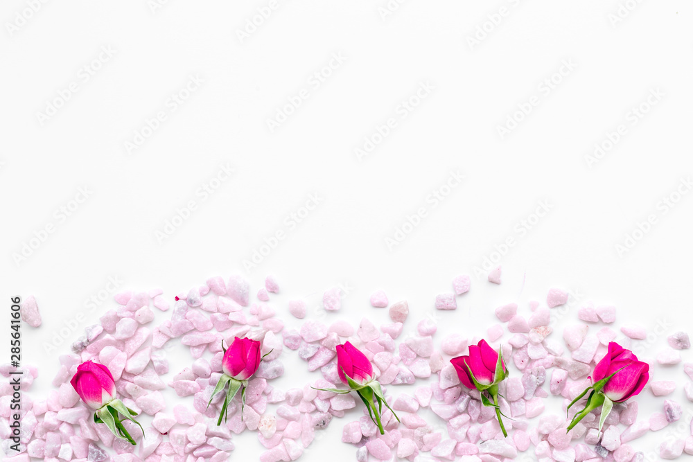 pink stones frame on white background top view