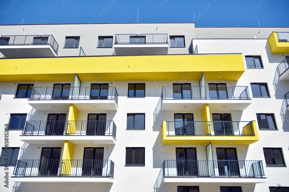 Modern apartment buildings on a sunny day with a blue sky. Facade of a modern apartment building