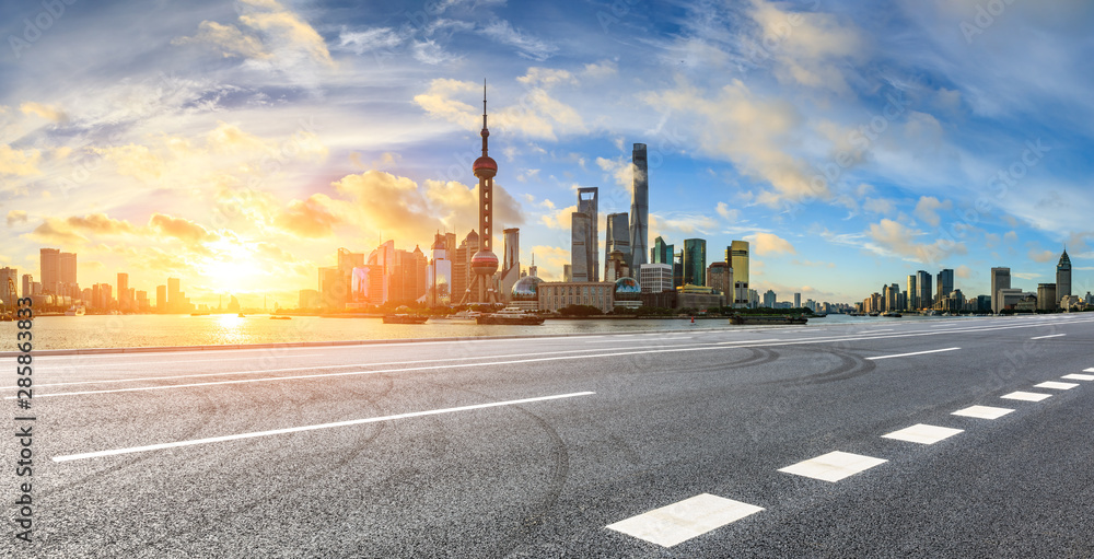 Empty highway and beautiful city buildings scenery at sunrise in Shanghai,China.