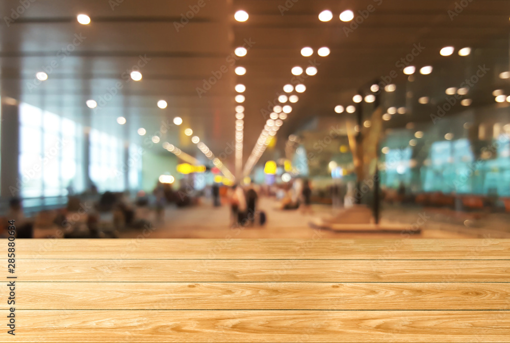 Wood table in conference hall background with empty copy space for product display.