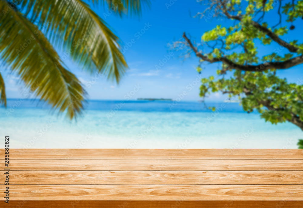 Brown wood table on summer tropical beach background with empty copy space on the table for product 