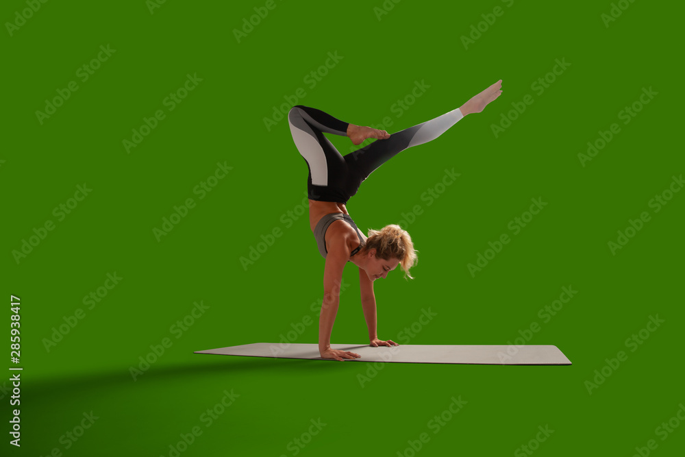 Yoga woman isolated on green screen.