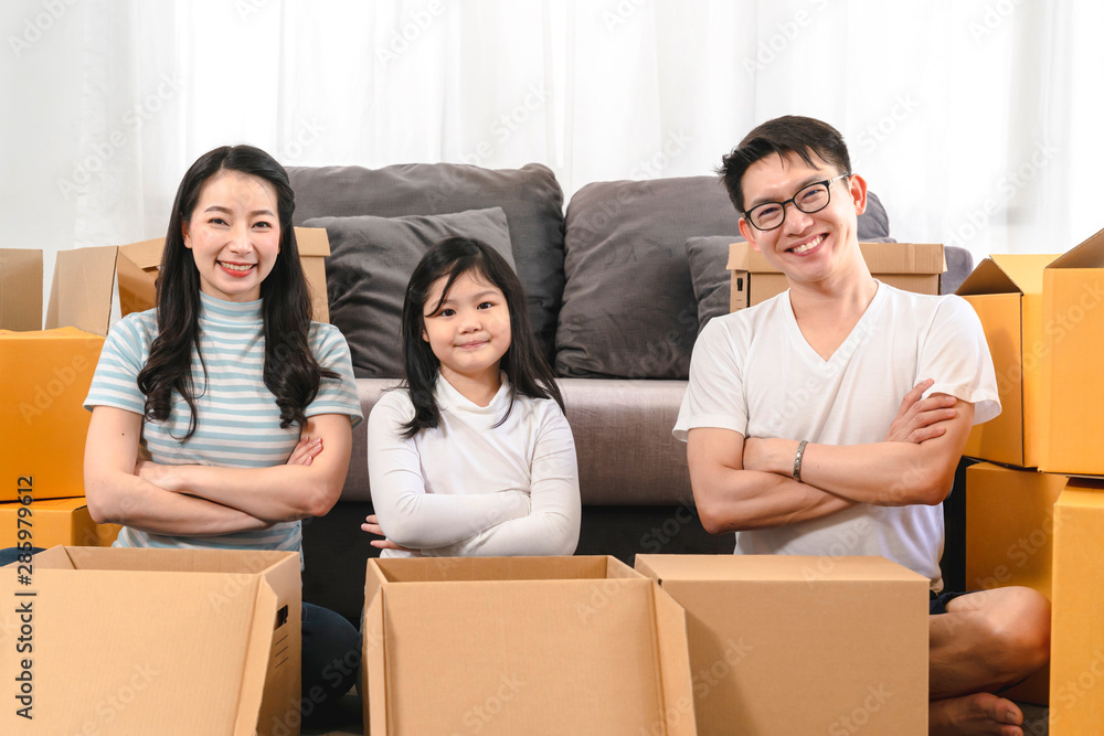 asian happiness family smile and look at camera unpack stuff in new home house moving ideas concept