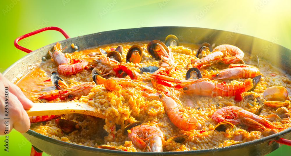 Paella. Traditional spanish food, seafood paella in the fry pan with mussels, king prawns, langousti