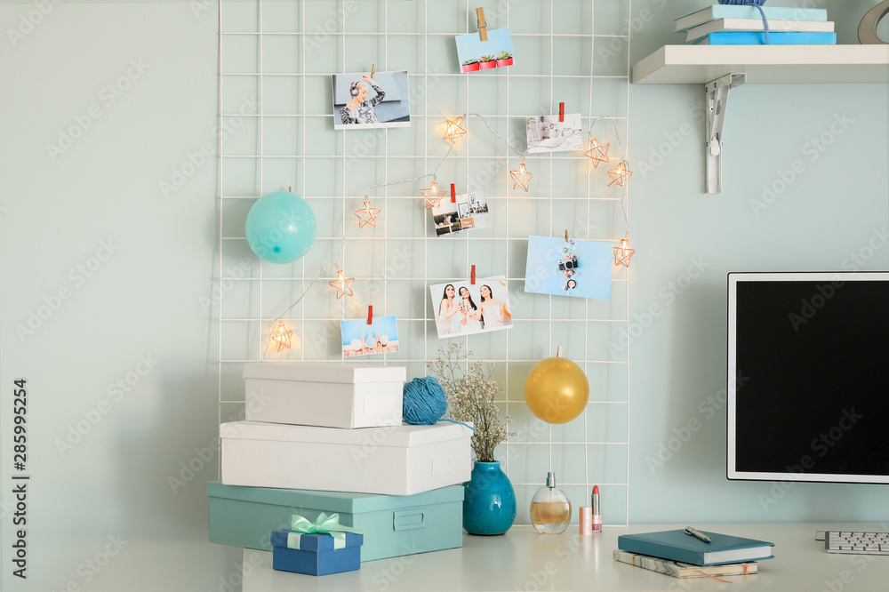 Workplace with mood board and computer in modern room